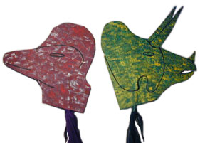 red Corythosaurus and green Chasmosaurus hobbyhorse heads